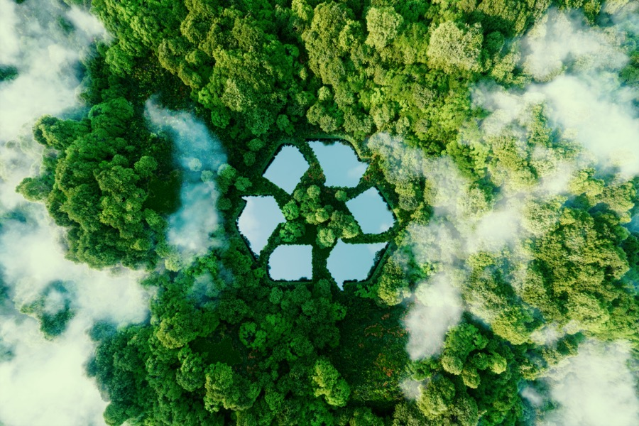 Six ponds appear in the shape of the recycling logo in the middle of a forest