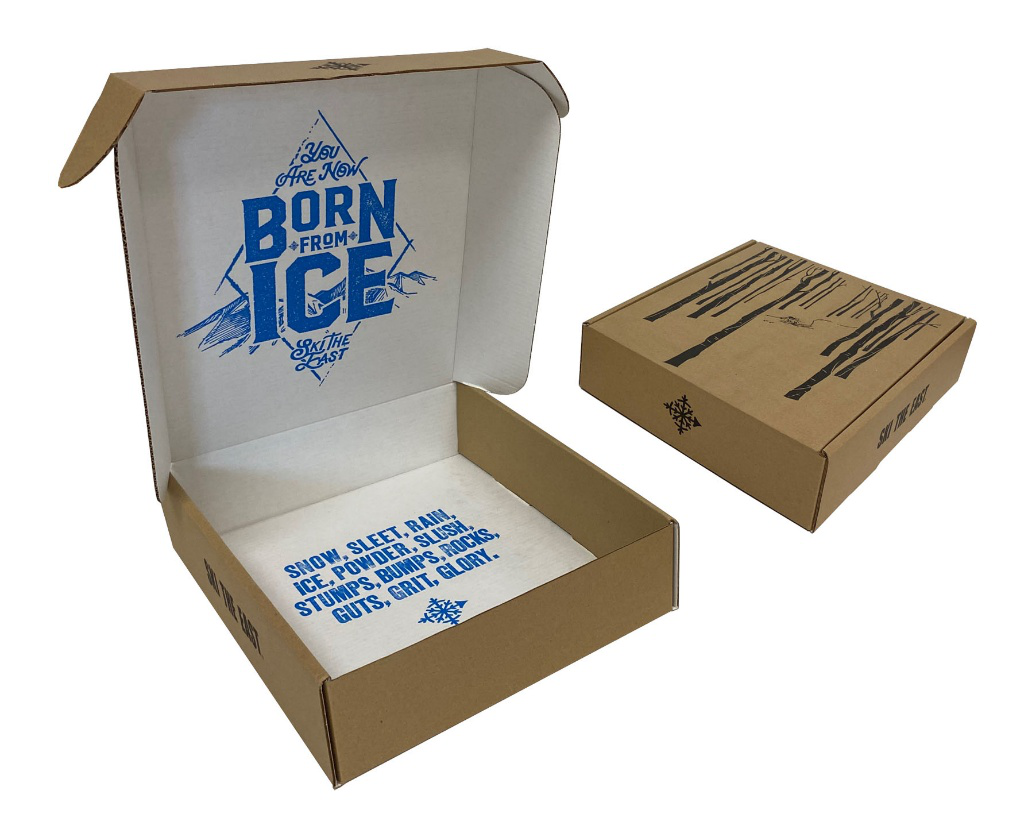 A custom corrugated ecommerce packaging box designed by BCI featuring bold blue interior graphics and a durable structure for subscription deliveries