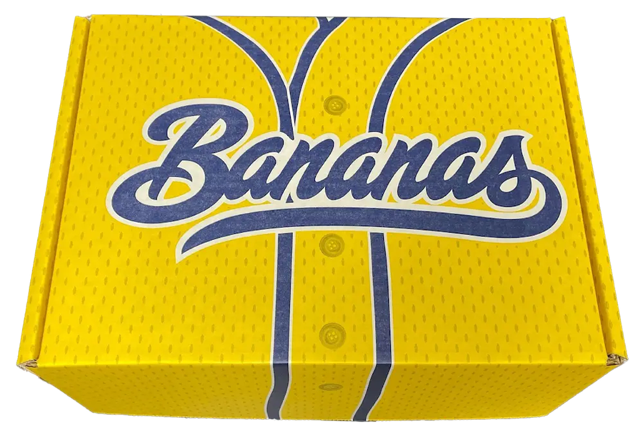 A bright-yellow custom-printed corrugated mailer box featuring the Savannah Bananas logo and a baseball jersey graphic design.